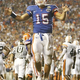 Illustration for article titled Tim Tebow Messiah Watch: Touching The Hem Of His Garment Edition